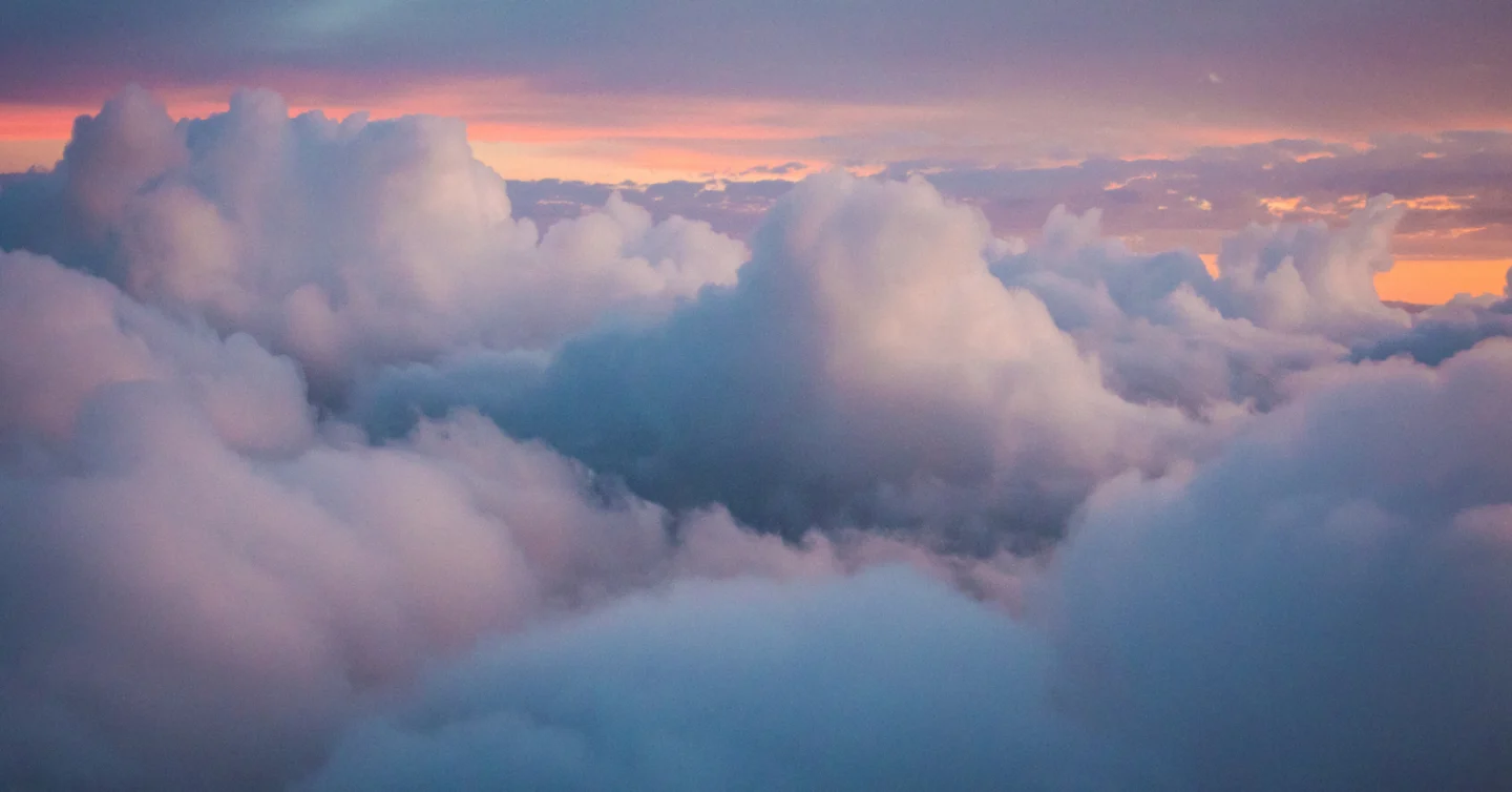Clouds stretching into the distance in the soft light of evening