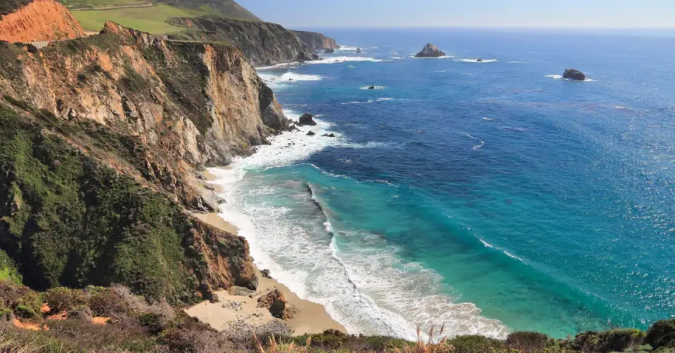 Pacific waves meeting the rugged California coastline