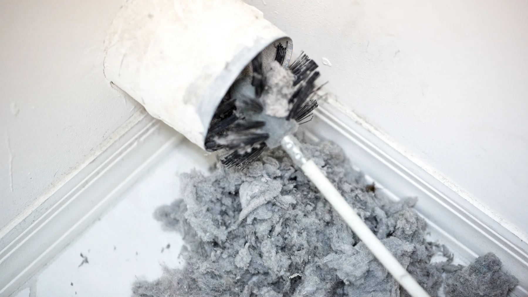 Dryer exhaust connection with lint; illustrative service photograph