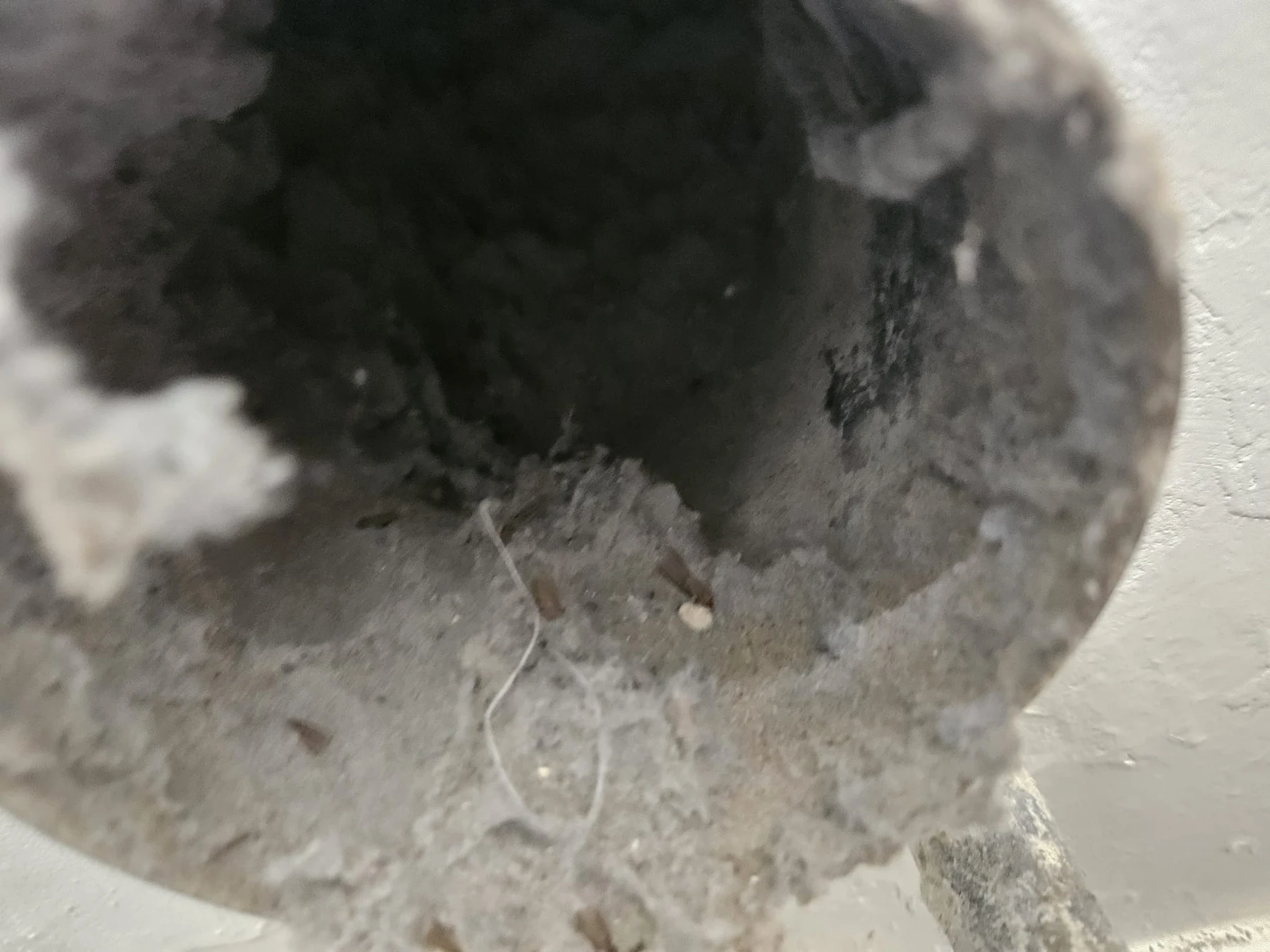 PAC archive photograph of thick dust and debris accumulated inside ductwork